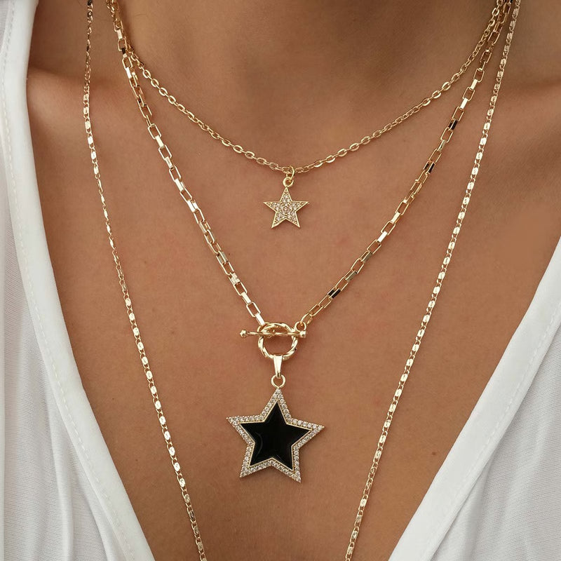 ATELIER MIU Collier multiple étoile - Laiton doré à l'or fin & zircons